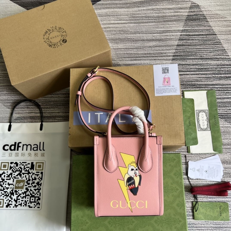 G*u*i top handle bags